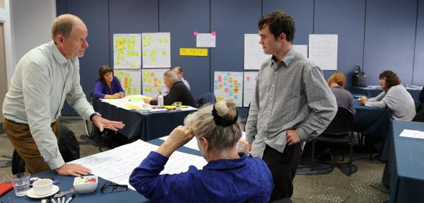 John and Shane discuss issues at the fourth workshop