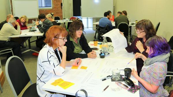 Tina, George, Gerri and Esther look at the new system design